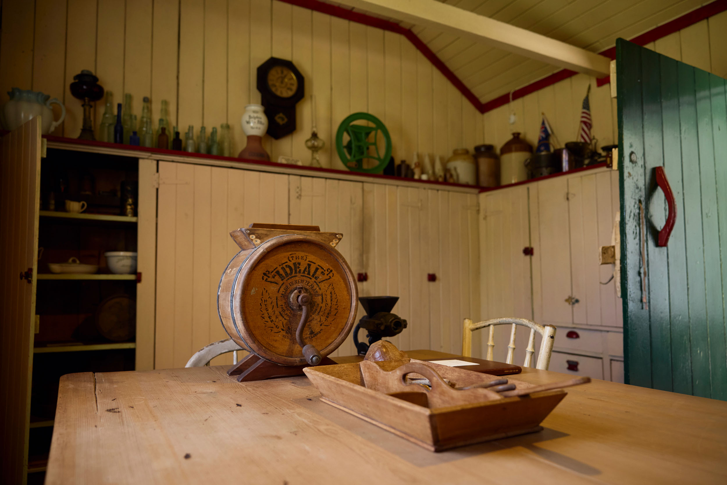 Old fashioned kitchen with butter churn on table