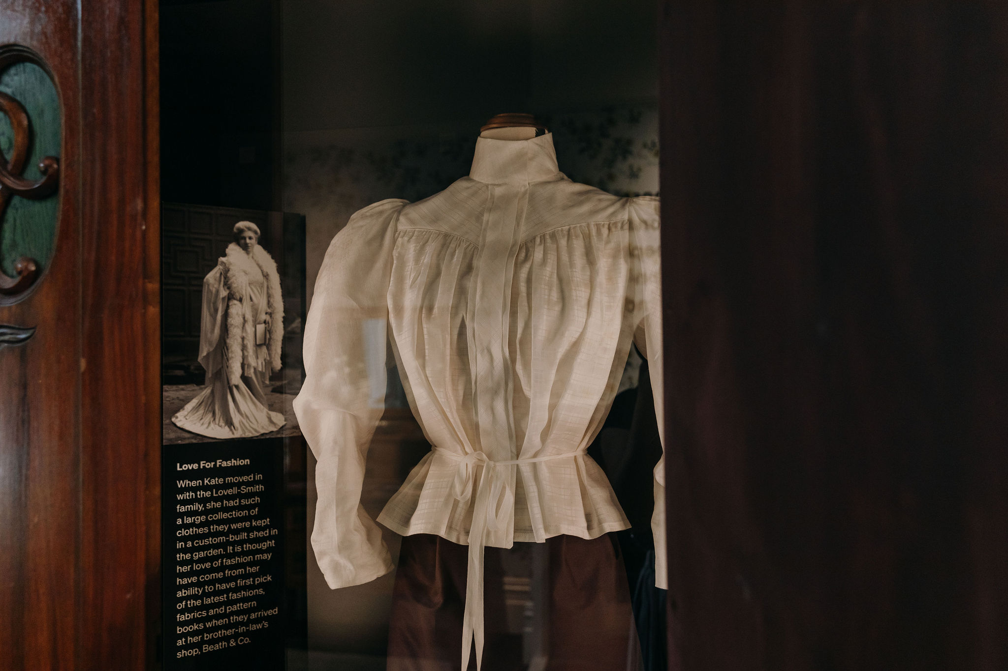 cream shirtwaist blouse in display cabinet