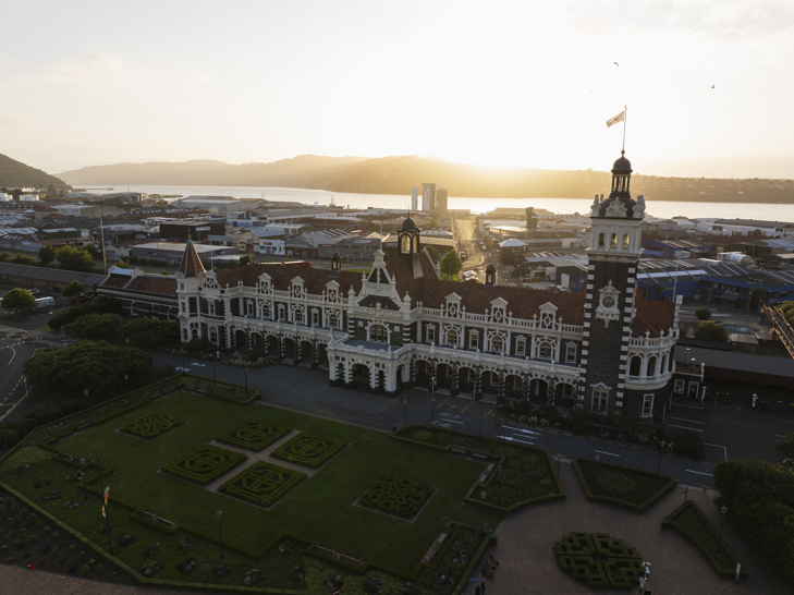 Birds eye view of grand Dunedin Railway Station at sunrise