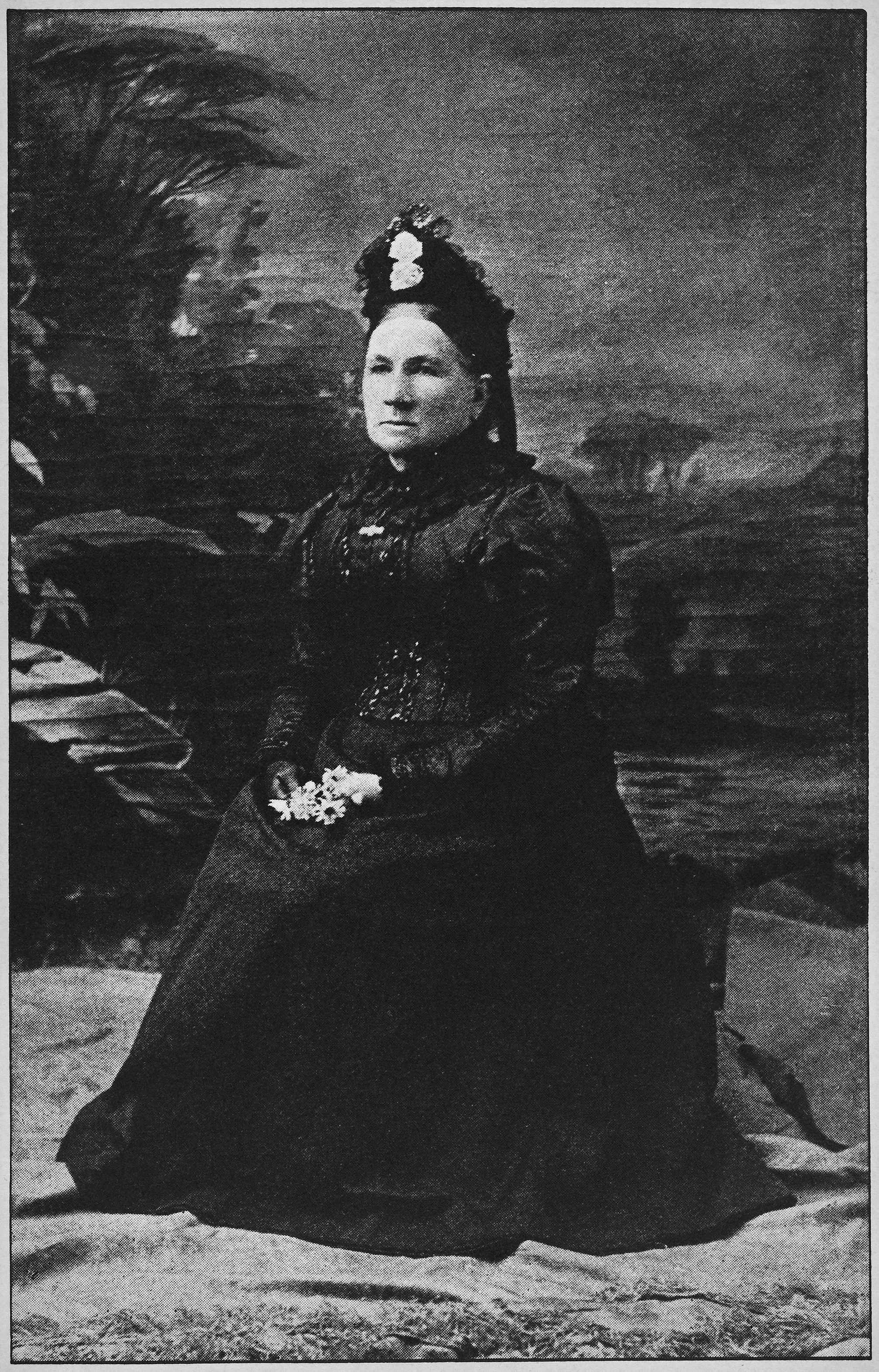 black and white seated portrait woman in Victorian black dress and turban